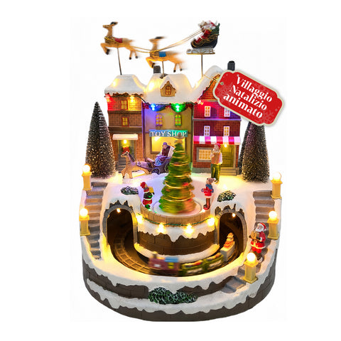 Jasno oświetlona wioska bożonarodzeniowa Xmas Town na baterie z diodami LED, muzyką, obracającą się choinką, poruszającym się pociągiem i saniami Świętego Mikołaja, 27x25x34 cm